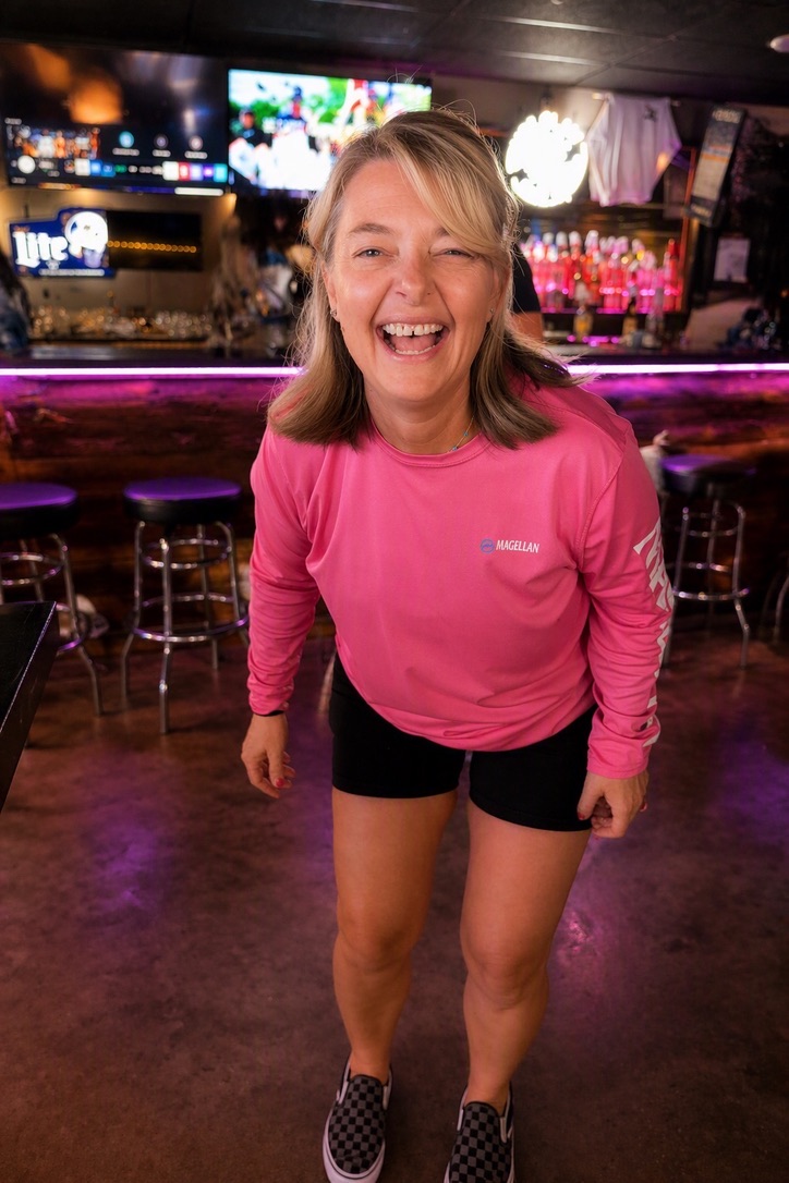 Amber smiling in a pink shirt
